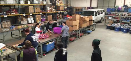 Workers in a packing facility